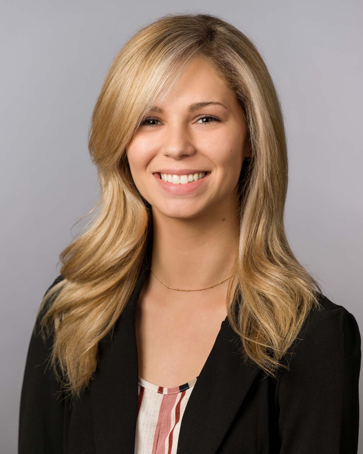 Professional real estate agent headshot in Houston, Texas, featuring a confident and polished Realtor®. This high-quality business portrait is ideal for use on MLS listings, LinkedIn, real estate brokerage websites, business cards, and social media marketing.